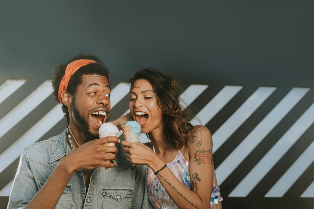 man and woman eating ice cream together