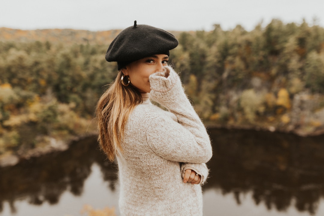 woman standing in front of body of water