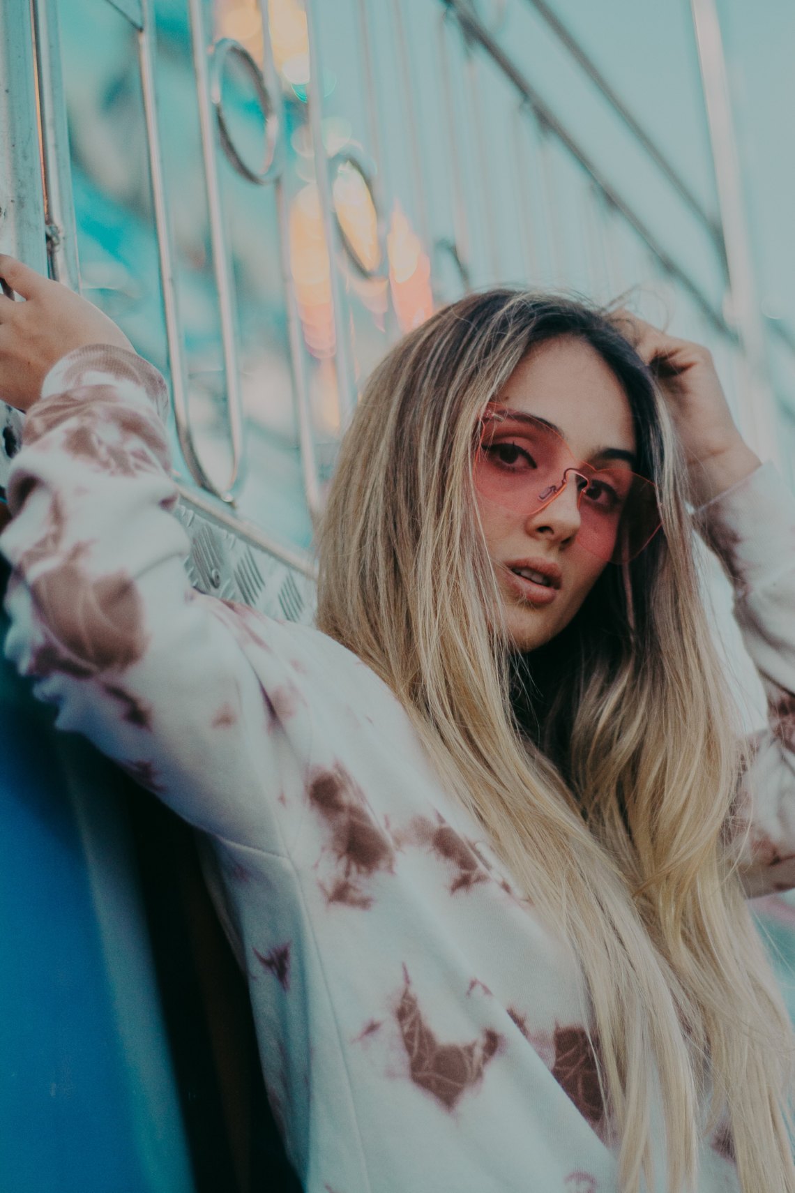 girl in a sweatshirt and sunglasses