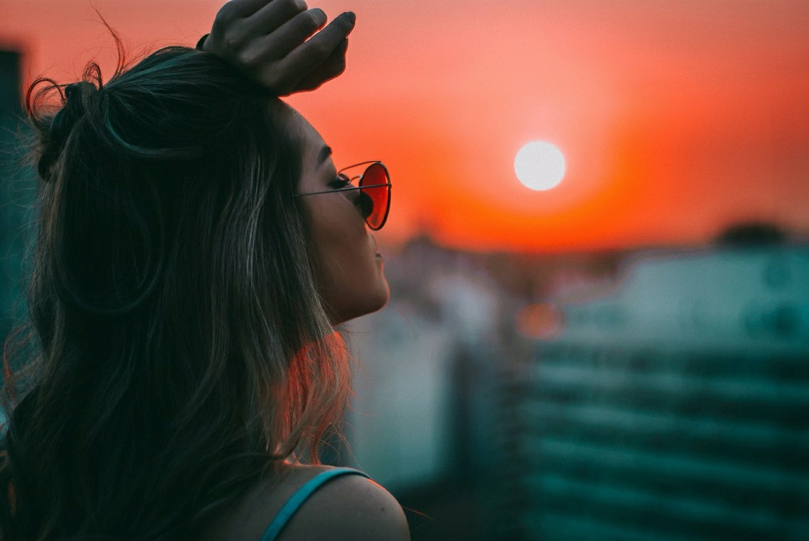 girl at dusk with sunglasses