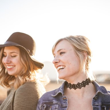 two friends laughing in the sun