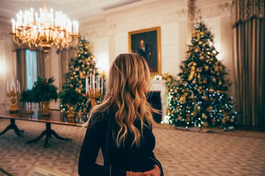 woman looking at christmas tree, holidays, holiday season, reminders, simple reminders, fight the holiday blues