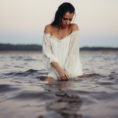 woman wading through the water