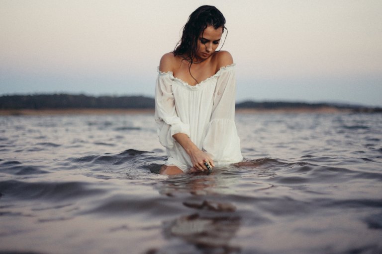 woman wading through the water