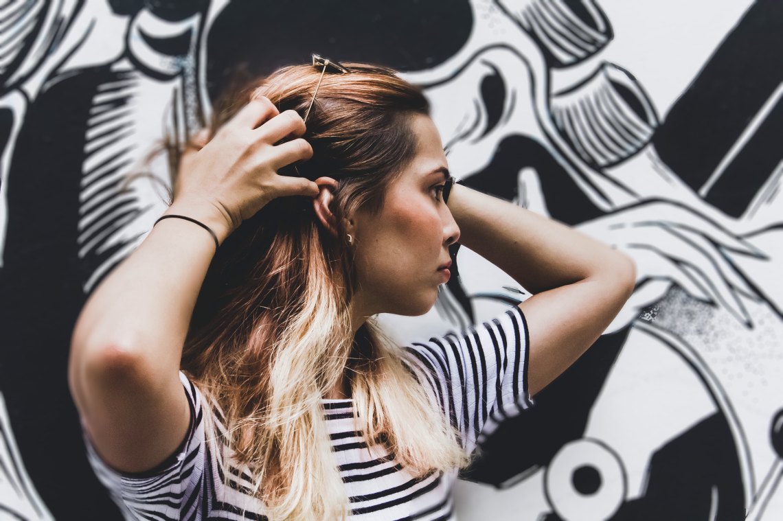 woman with hands in her hair, questions women should stop asking, feminism