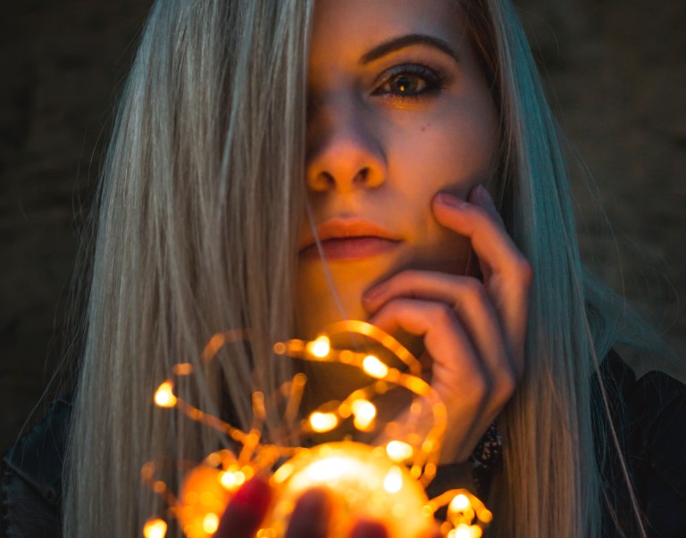 girl with lights, somber girl, heart burning with passion, passionate, new year