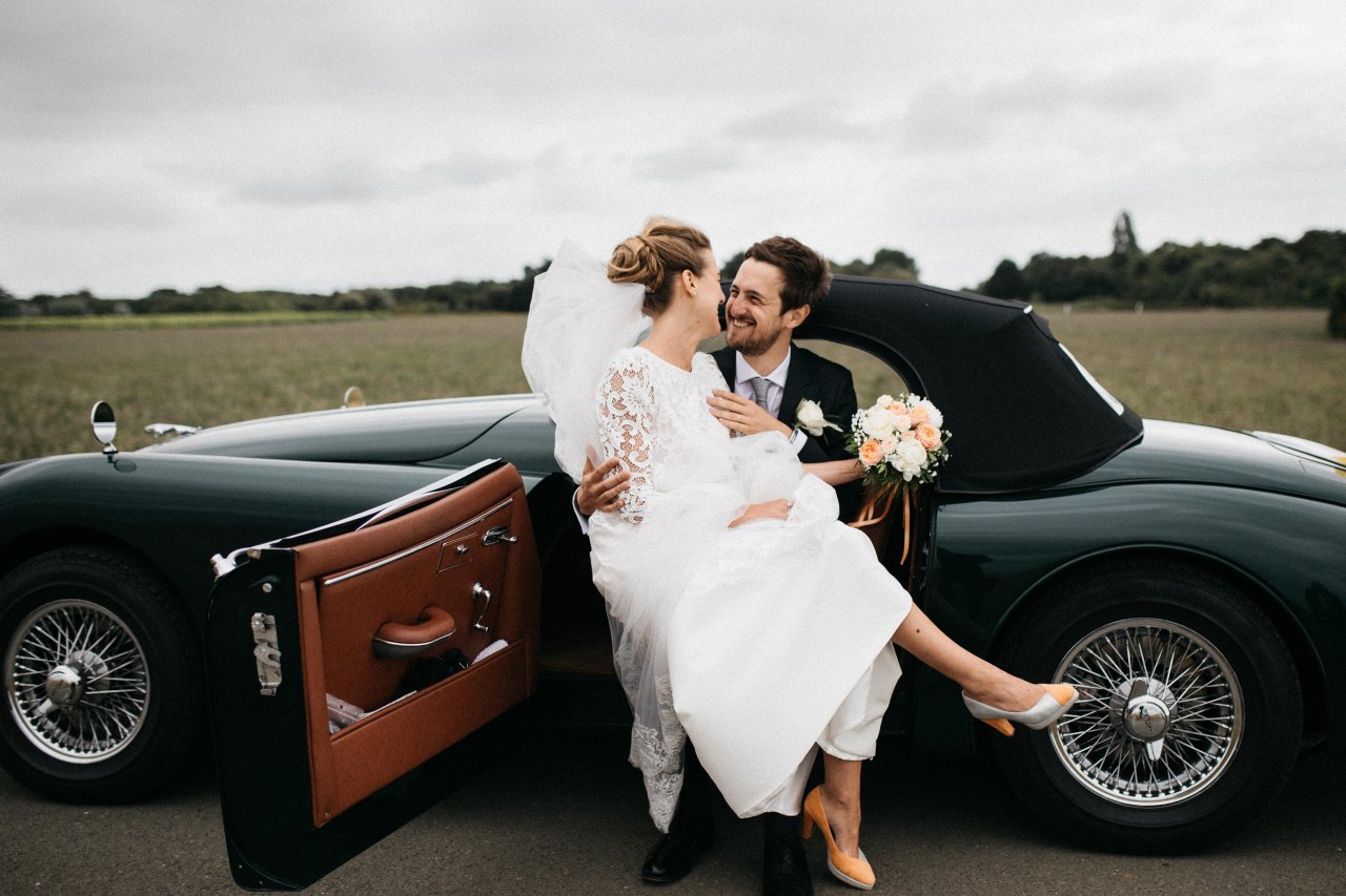 Bride and groom in car