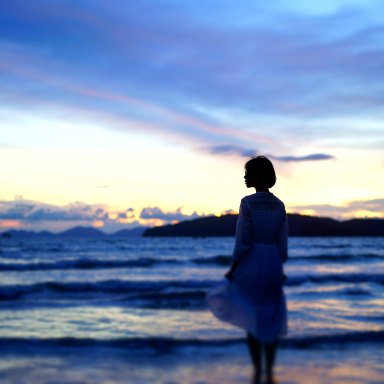 woman looking at the ocean