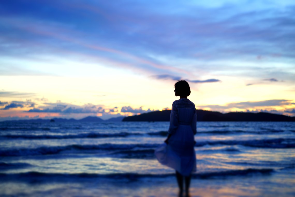 woman looking at the ocean