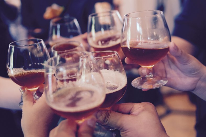 People toasting with beer