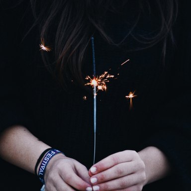 girl holding a sparkler