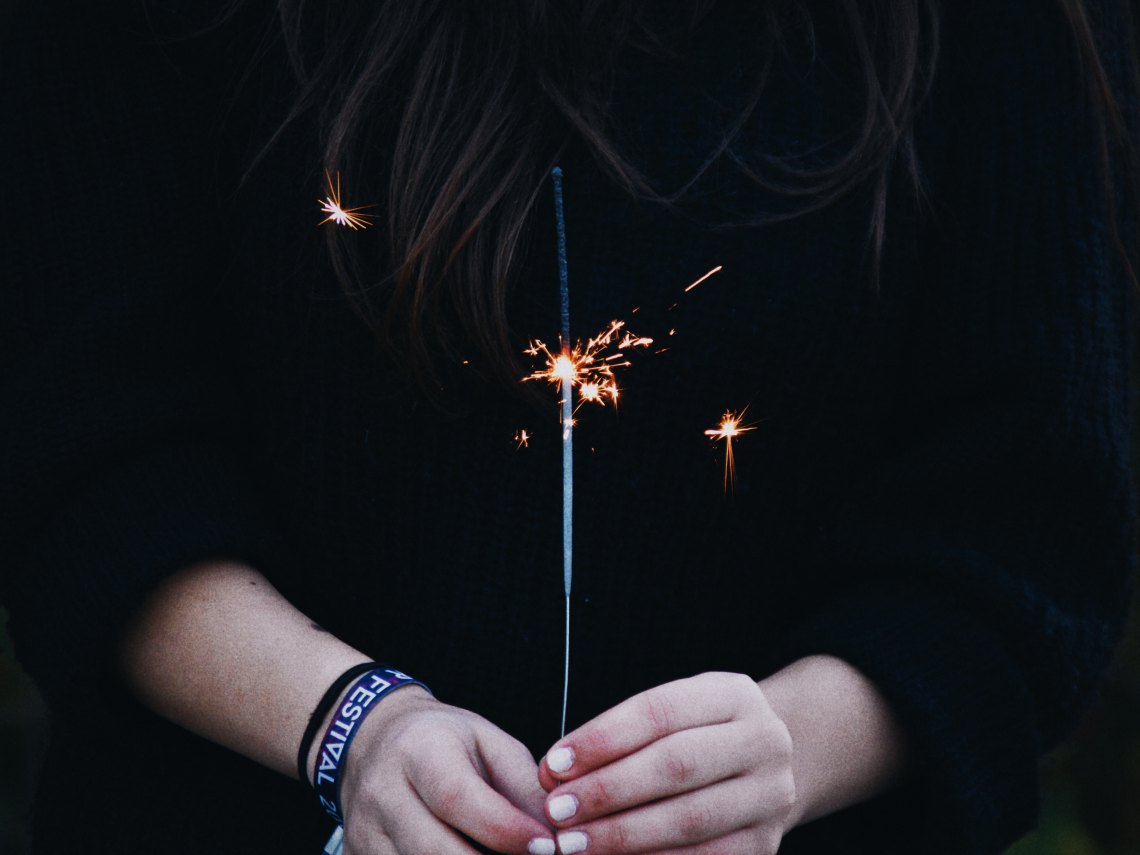 girl holding a sparkler