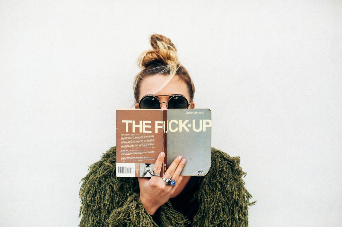 girl reading a fuck up book