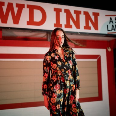 woman standing in front of closed store