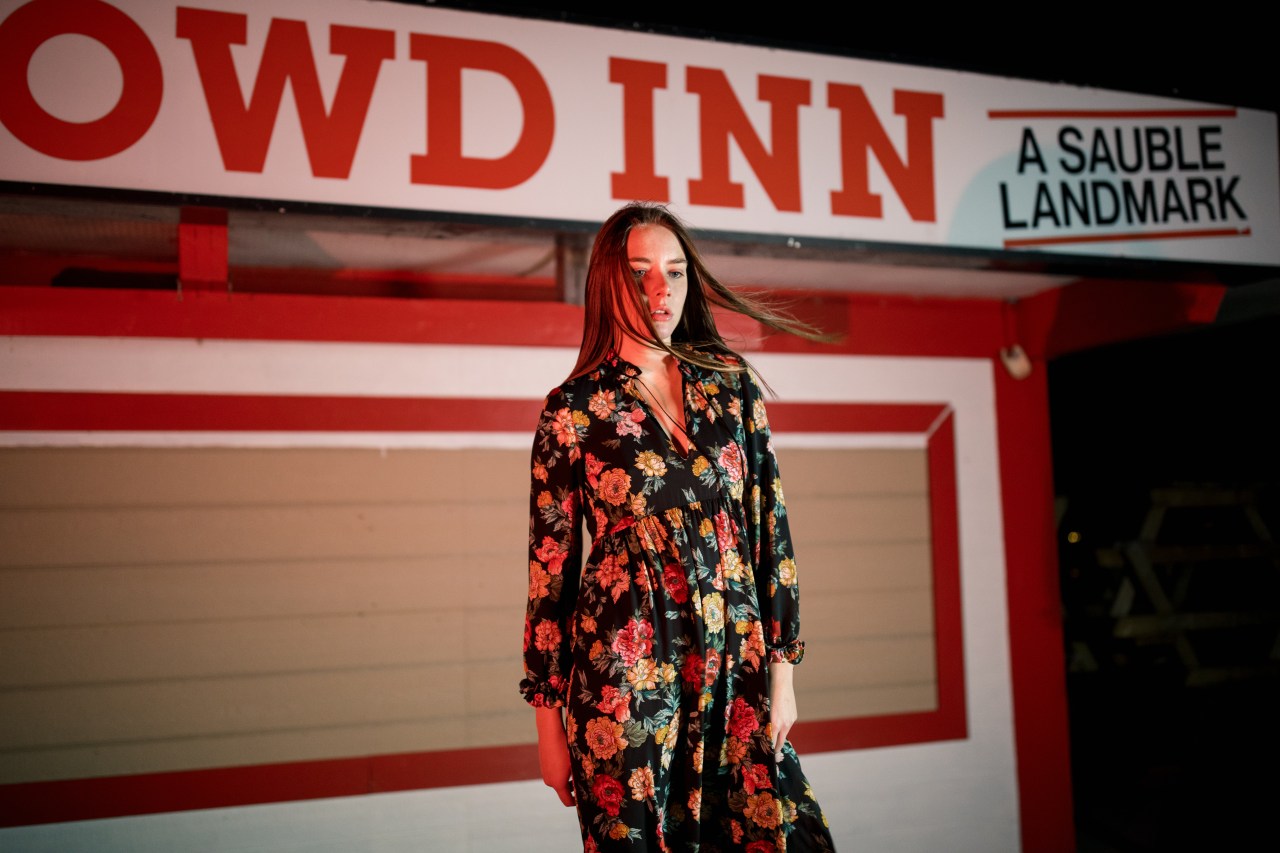 woman standing in front of closed store