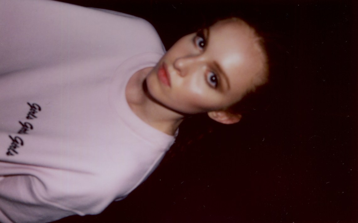 young redheaded girl in pink sweater looking sad depressed mad angry lonely hurt