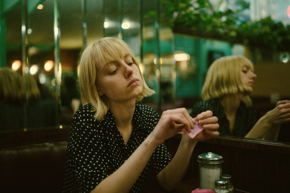 woman sitting in diner