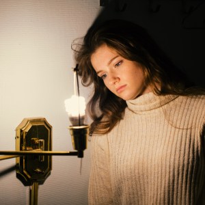 woman staring at light