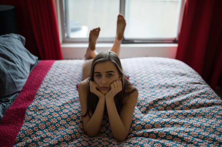girl laying on a bed