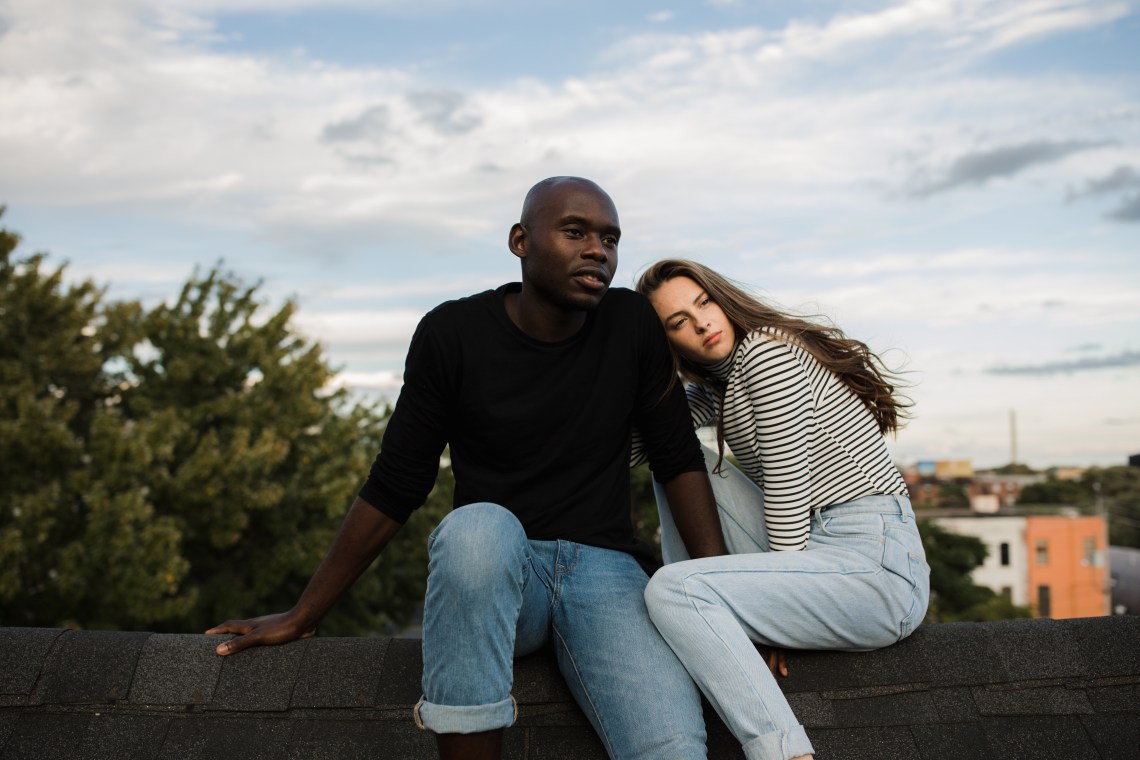 couple sitting on roof