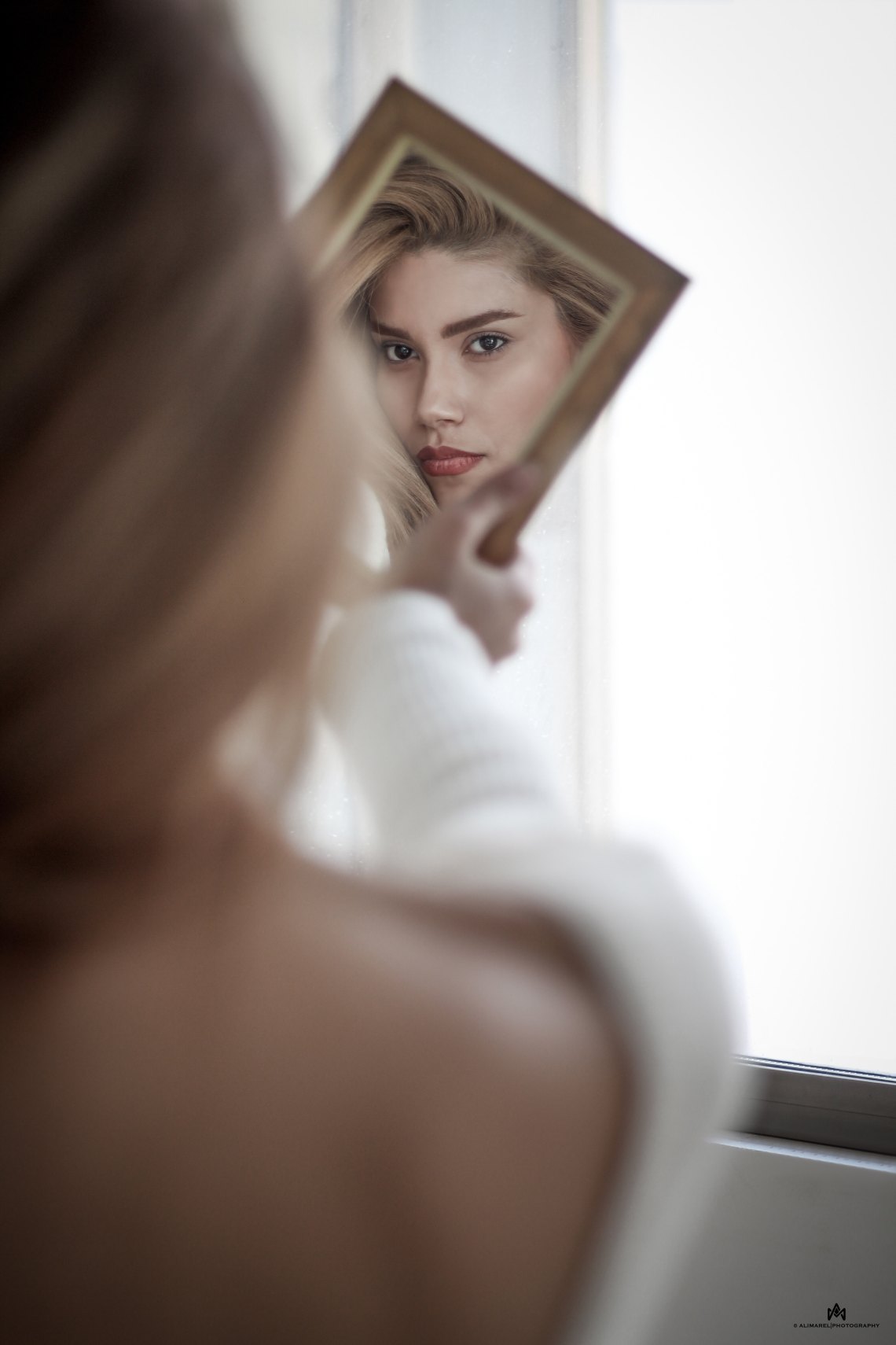 girl holding a mirror