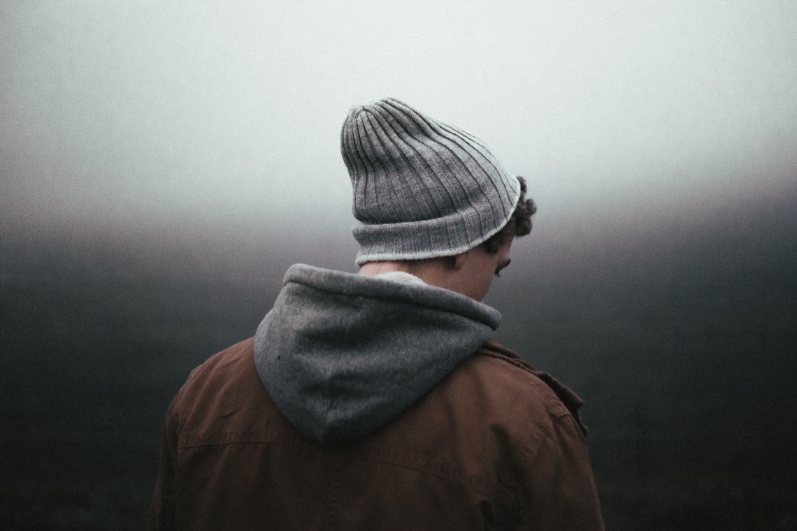 man standing looking sad