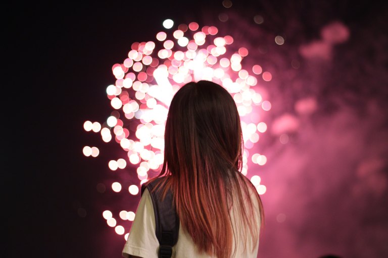 girl looking at fireworks