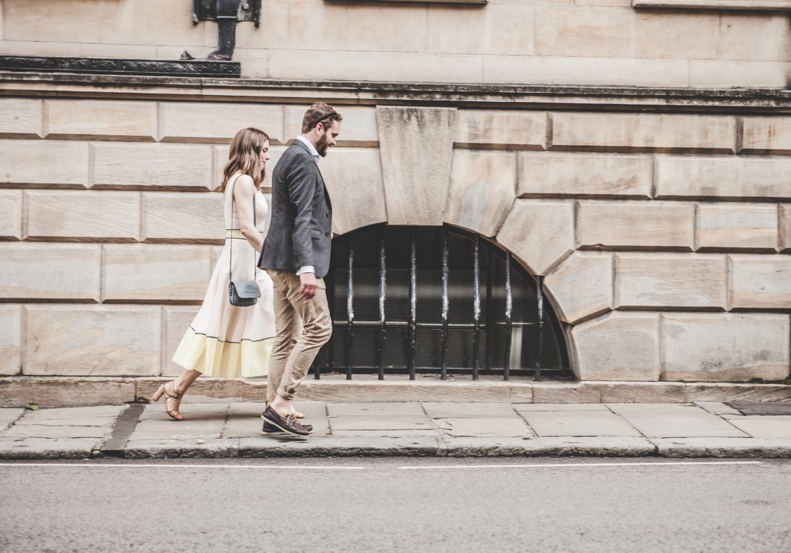 couple walking along street