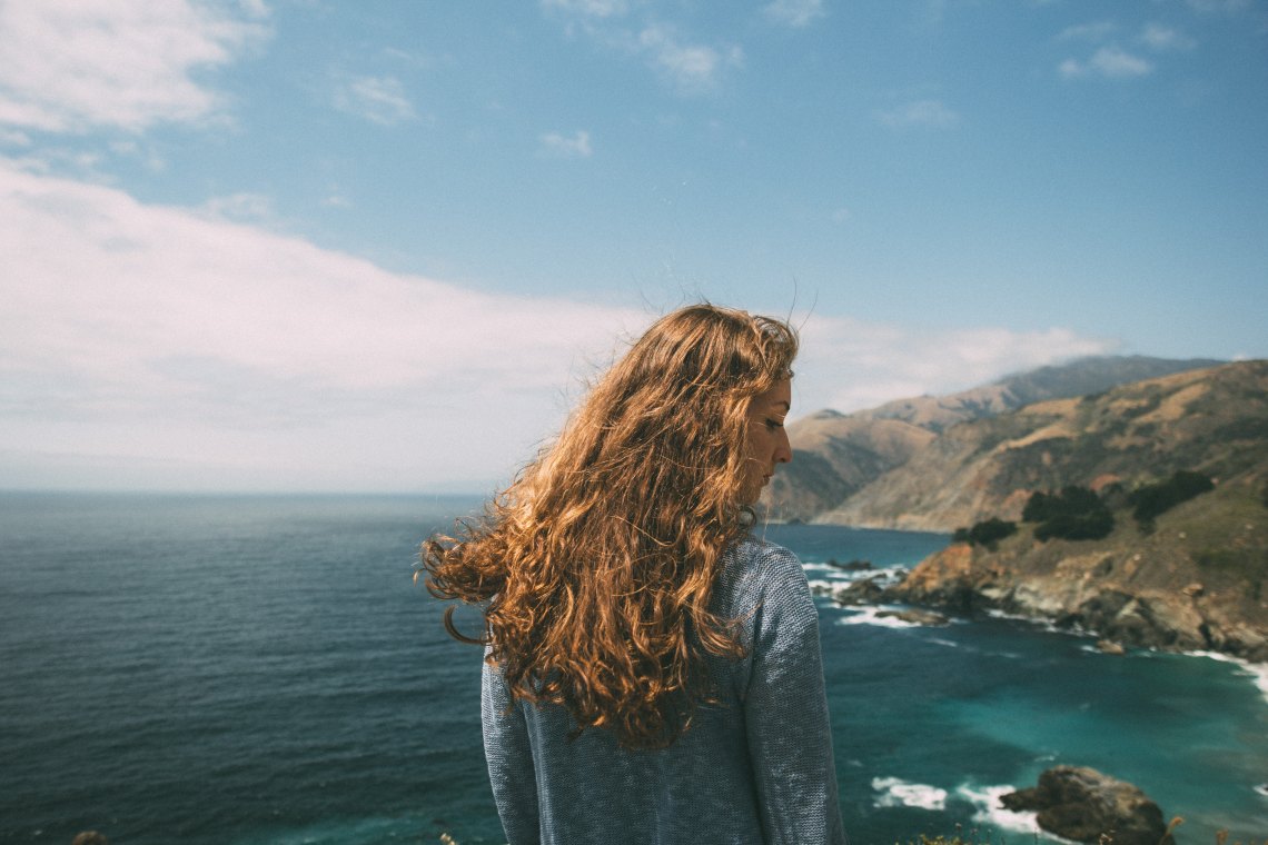 woman standing near the ocean
