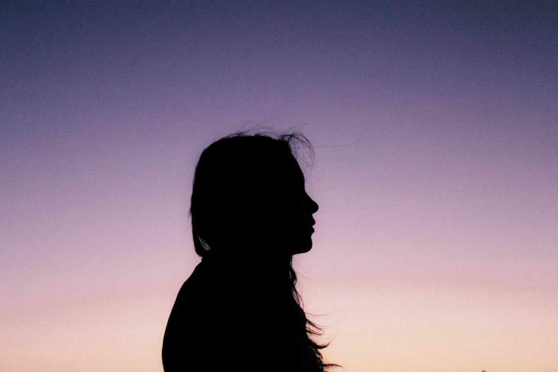 profile of woman at sunset