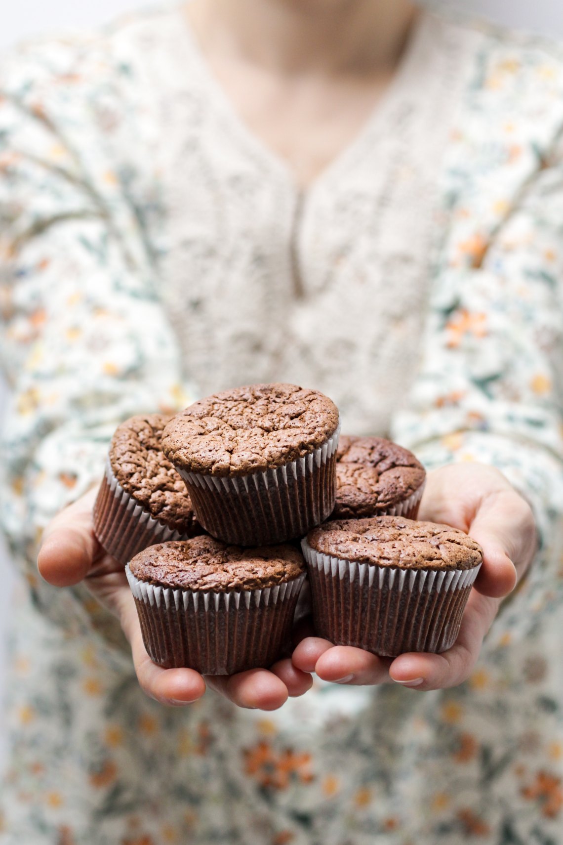 holding cupcakes