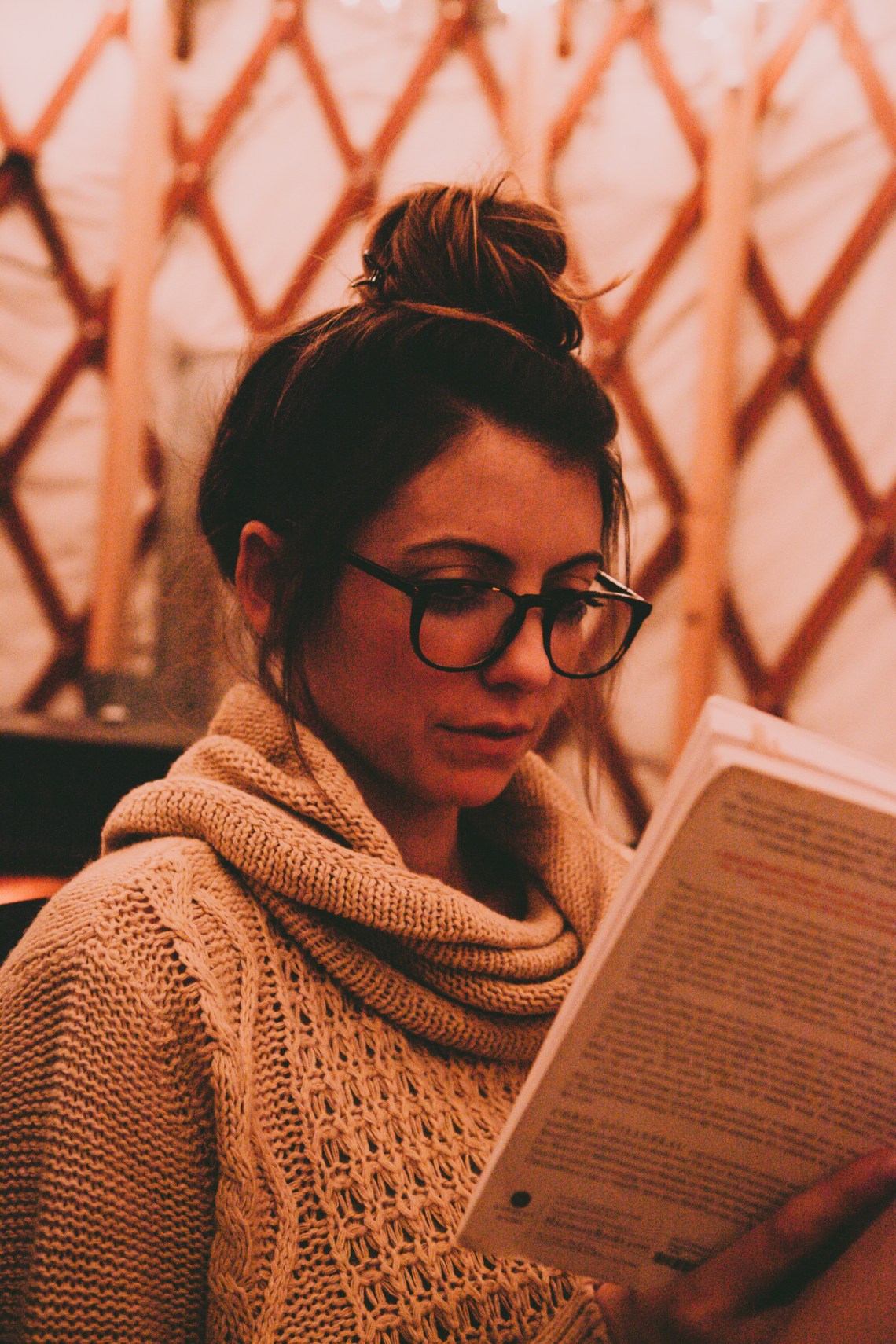 girl in glasses reading