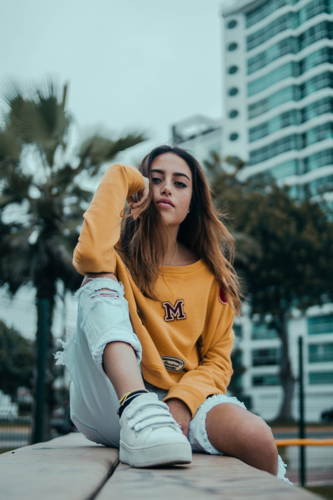 girl in cool sneakers and a sweatshirt
