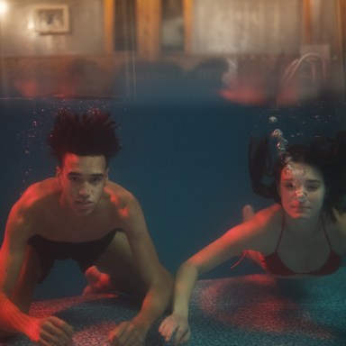 couple swimming underwater together