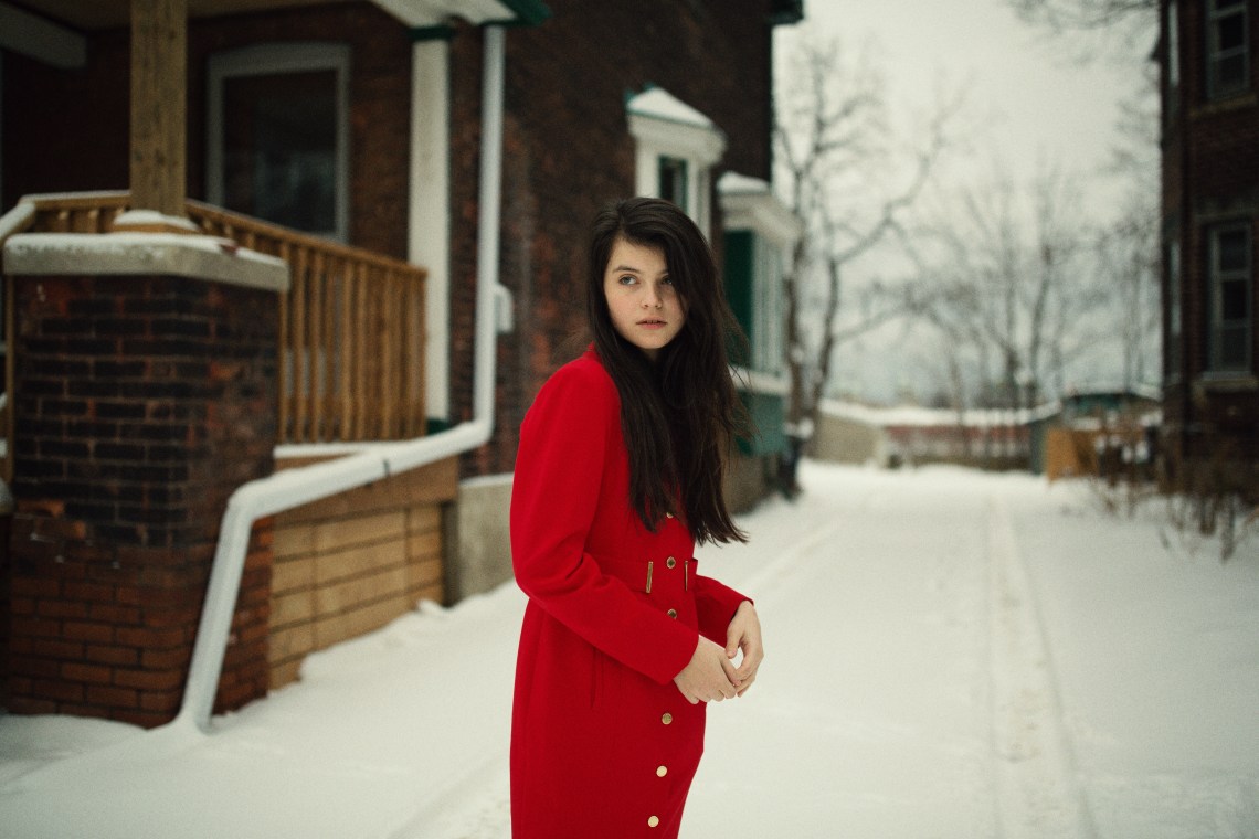 woman in red coat in winter