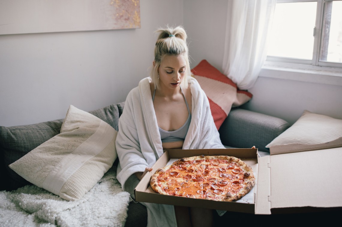 A girl with a pizza