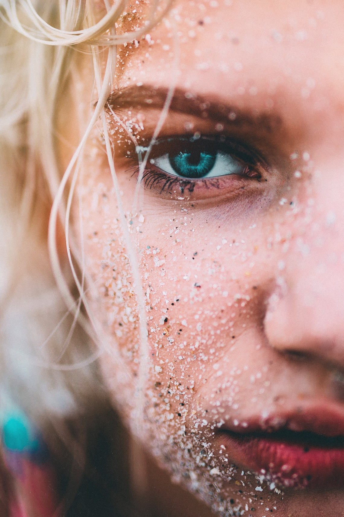 girl with sand or stuff all over her face