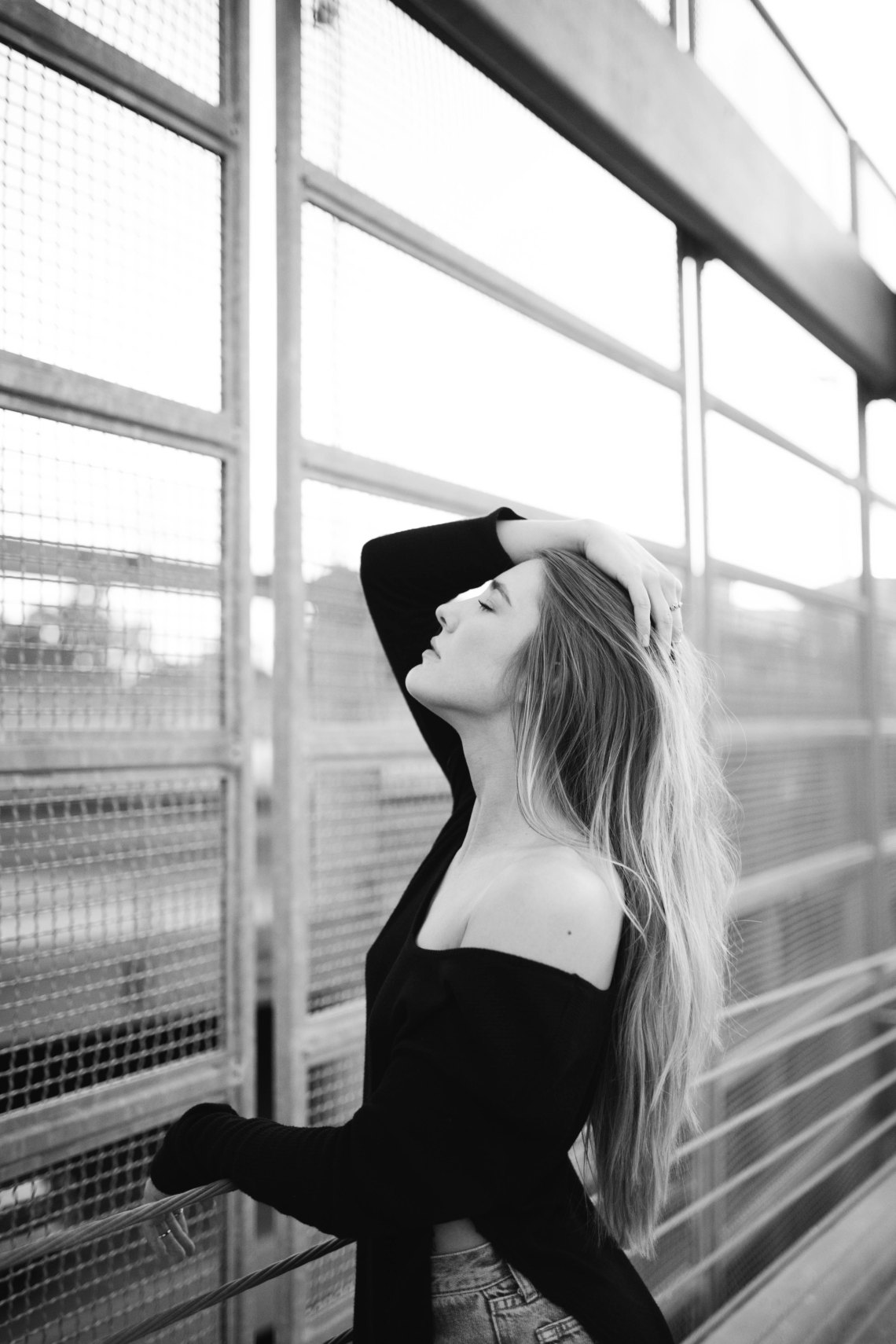 woman standing looking thoughtful
