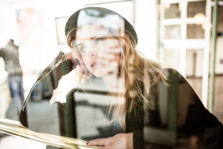 girl sitting in window