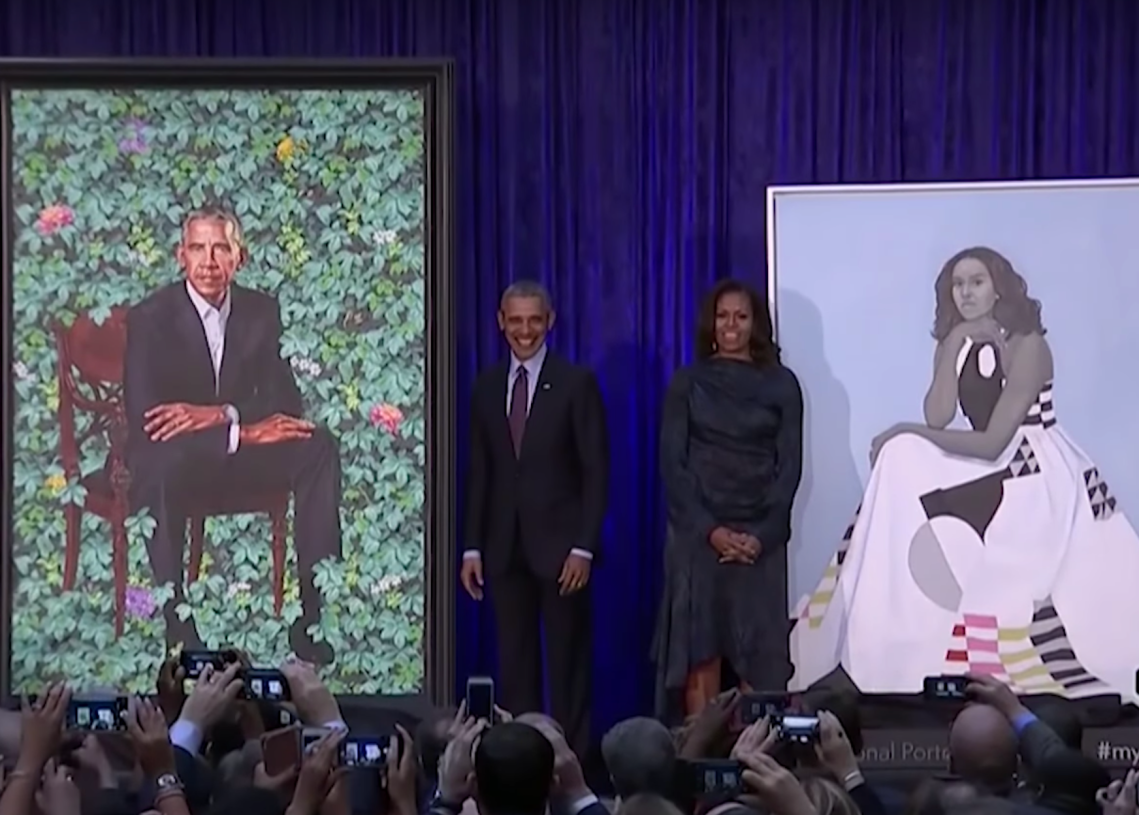 Barack and Michelle Obama at the unveiling of their presidential portraits