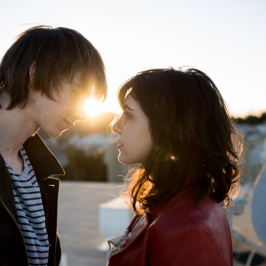 couple standing at sunset gazing into each other's eyes