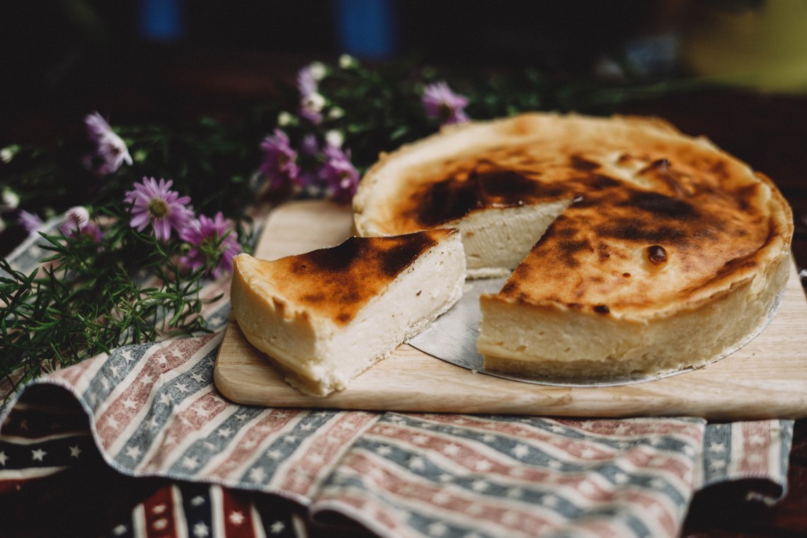 A beautiful cheesecake with a slice cut out