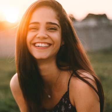 A classy, intelligent girl laughing
