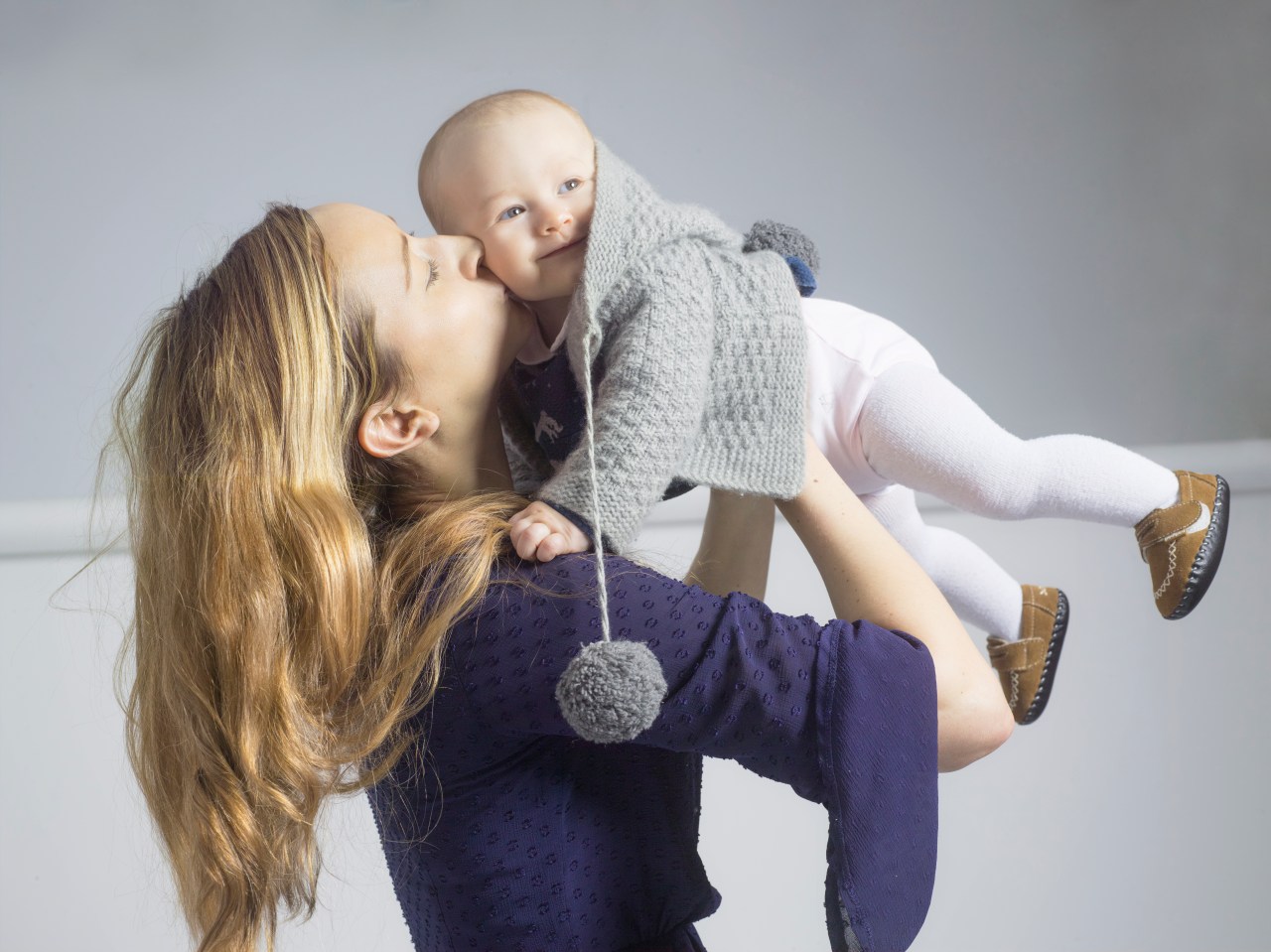 mother and baby kissing