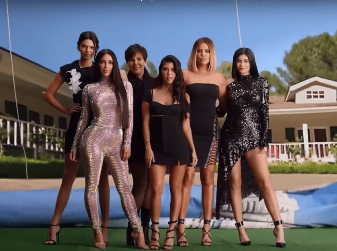 The Kardashians posing for their Decade of Kardashian advertisement