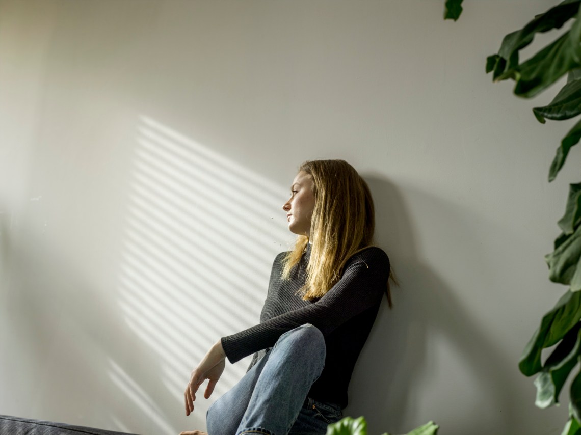 A woman with no friends inside her house