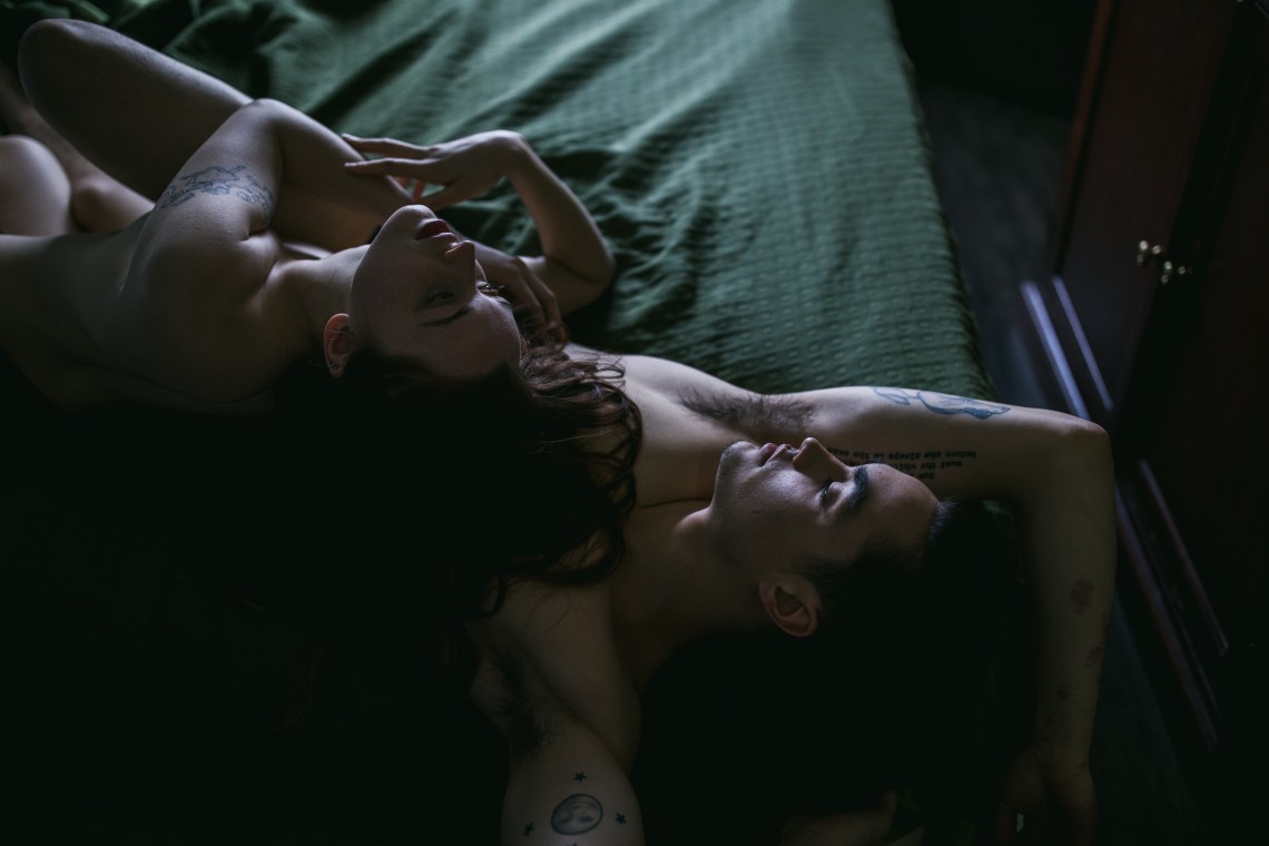 couple on bed in dim morning