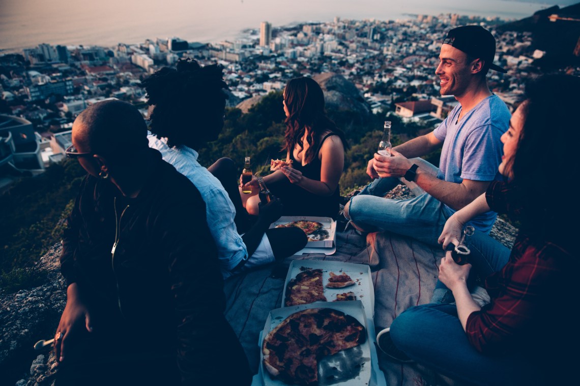 group of friends enjoying pizza