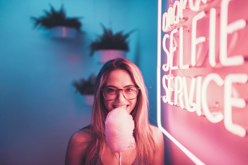 woman eating cotton candy