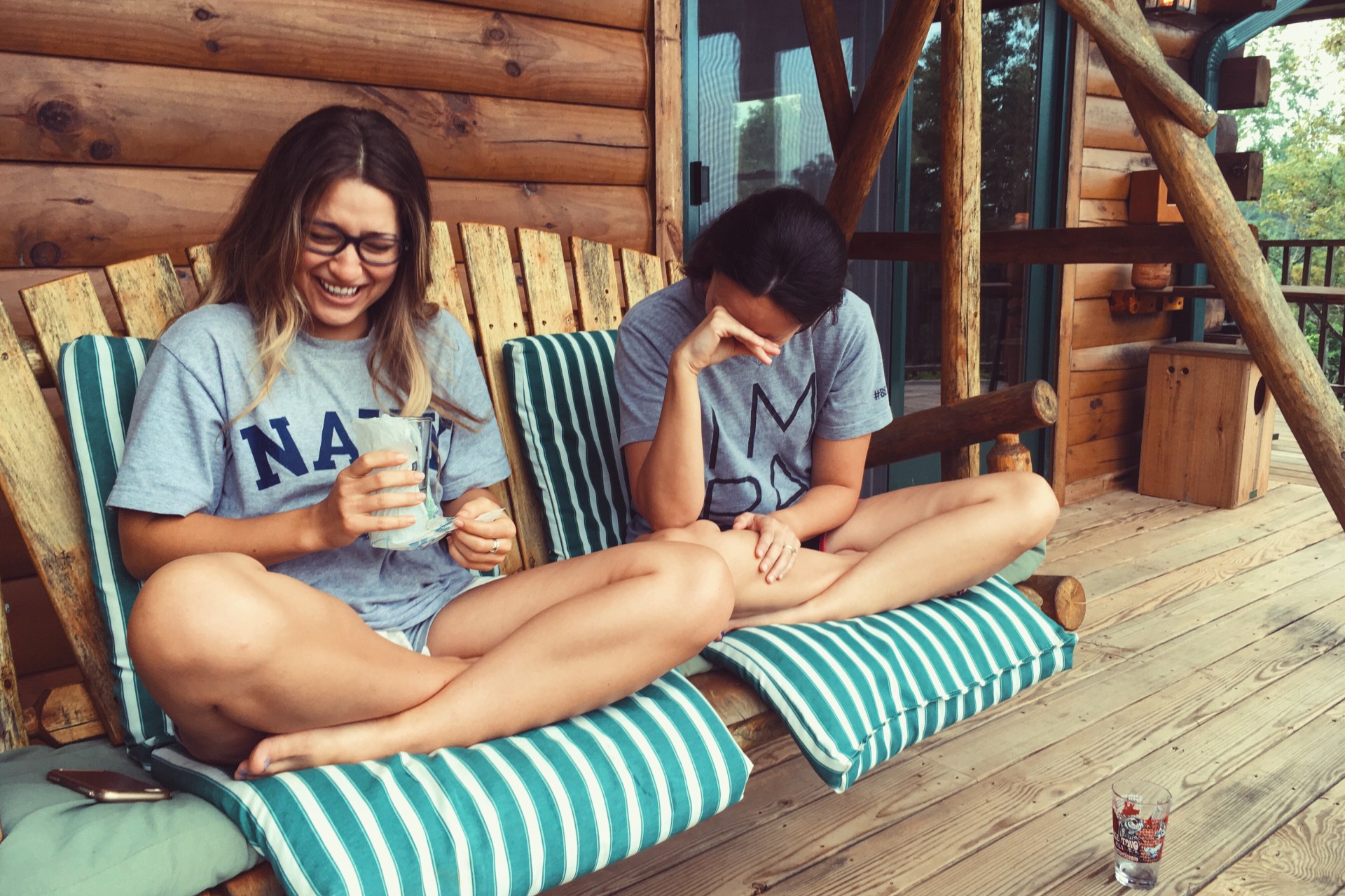 sisters laughing on porch